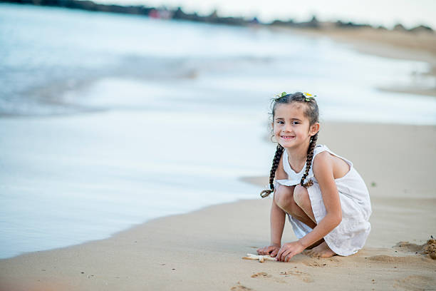 Little Girl on the Beach with a Starfish