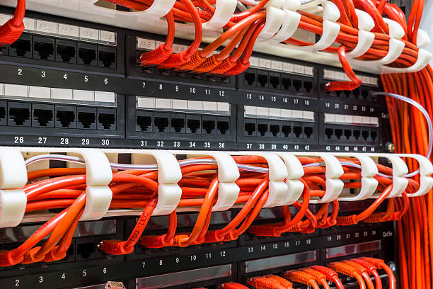 istock Close up of red network cables connected to switch 501702028
