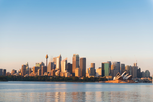 Color image of sunrise moments with clear sky on Sydney business district skyline.