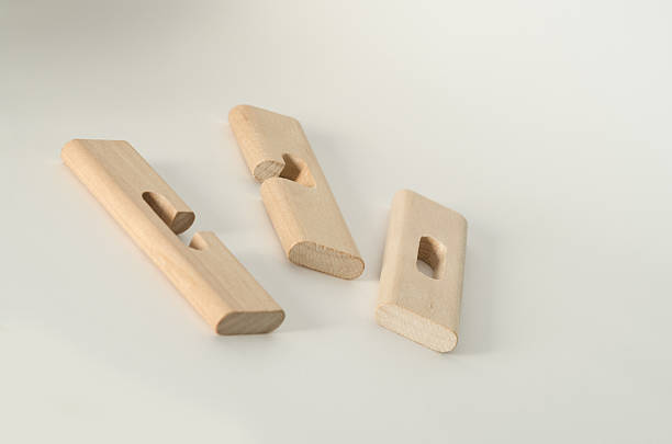 istock Three Pieces Wooden Puzzle Disassembled 501706574