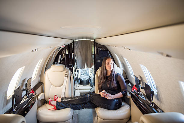istock Woman occupying two seats inside private airplane 501706830