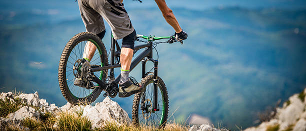 istock Mountain biker riding across rocks on a moutain 501707048