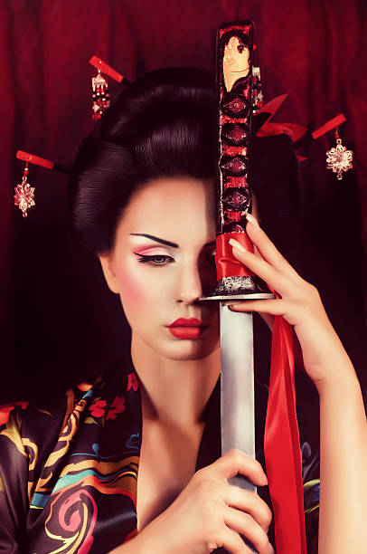 istock Beautiful geisha in kimono with samurai sword 501707180