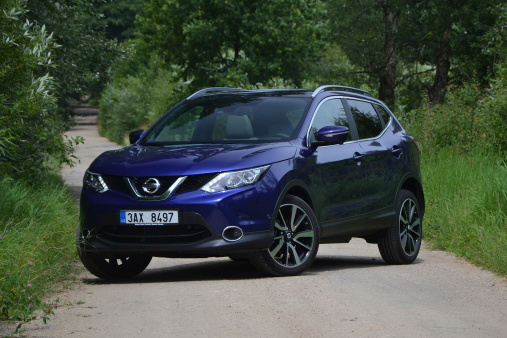 Nissan Qashqai. Warsaw, Poland - July, 5th, 2014. Test drive of Nissan crossover near the Warsaw city. The second-generation of the Qashqai, the most important car for Nissan in Europe, was revealed in 2013. The Qashqai is available in versions: 1.2 DIG-T (115 HP) petrol engine, 1.5 dCi (110 HP) diesel engine and 1.6 dCi (130 HP) diesel engine. The all-wheel-drive system is available only in the strongest version.