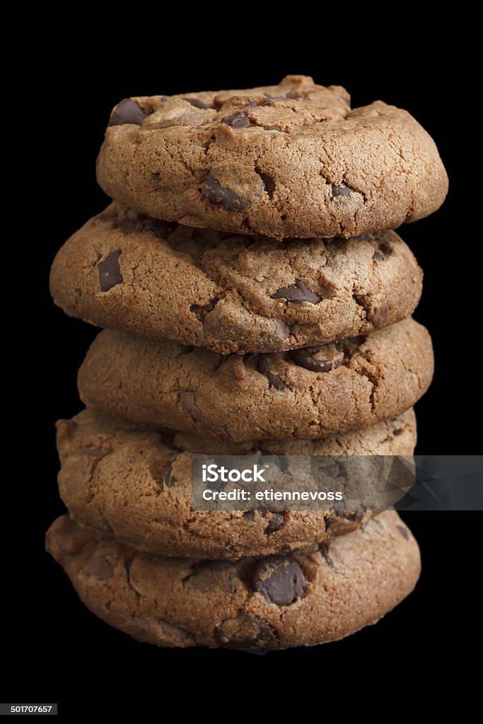 Stack of chocolate chip cookies isolated on black. Arranging Stock Photo
