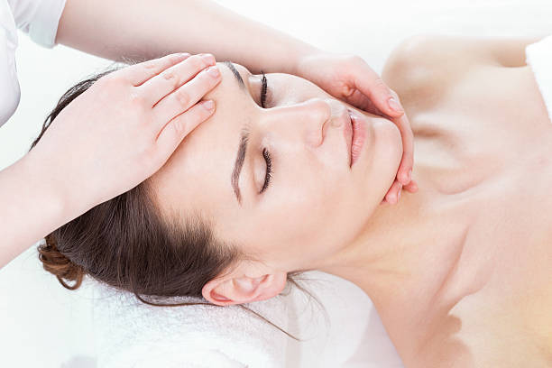 istock Young woman getting face massage 501708453