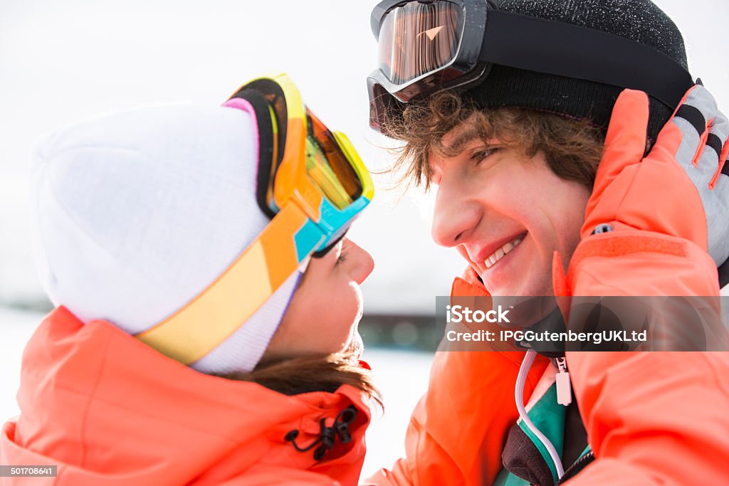 Young Adults Skiing and Snowboarding snow play in Winter Close-up of romantic young couple about to kiss during winter 20-24 Years Stock Photo