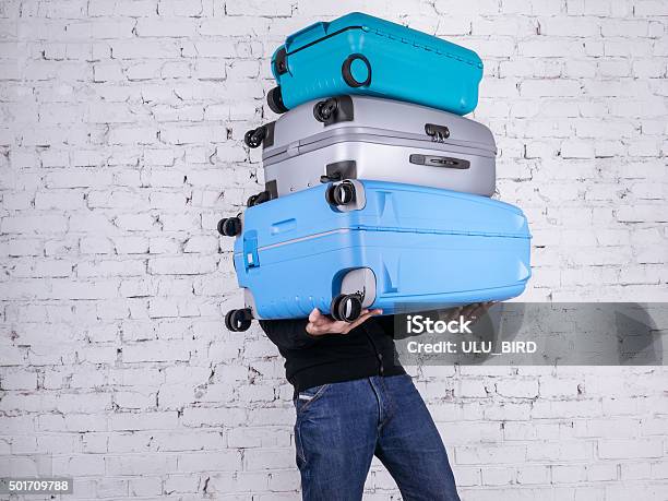 The Man With The Suitcases Stock Photo - Download Image Now - Luggage, Carrying, Heavy