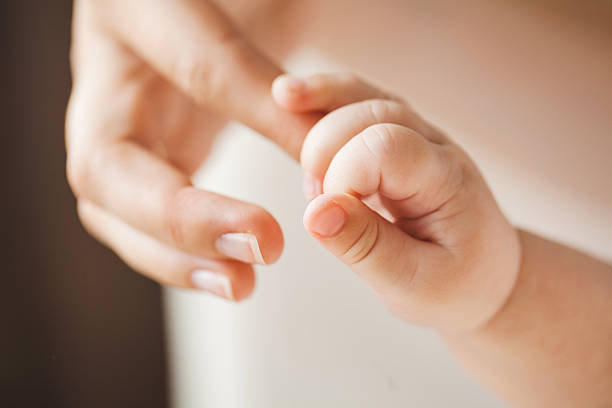 istock Newborn holding mother's finger. 501710064