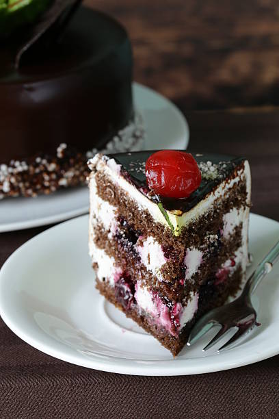 istock festive beautiful chocolate cake with icing and cherry 501710113