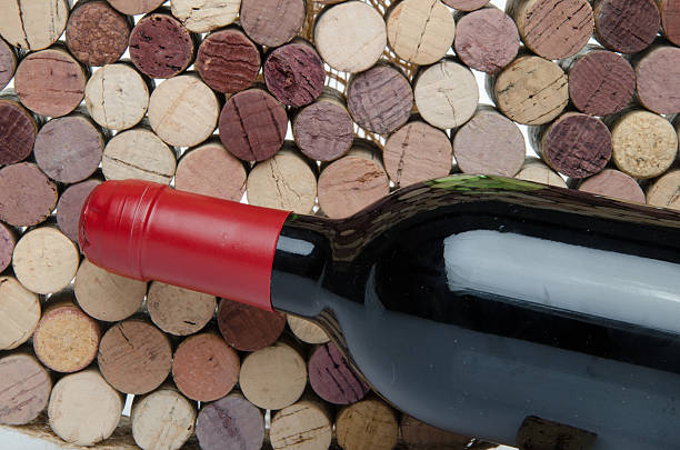 istock Bottle of wine on a background of corks 501710219