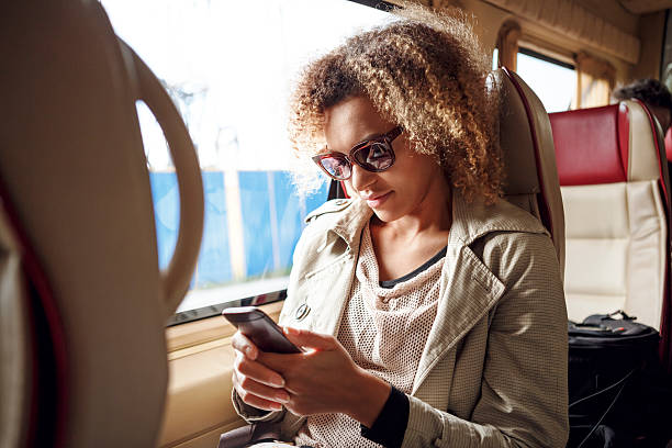 istock Happy woman texting on her mobile phone 501710636