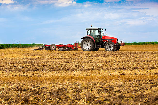 istock Tractor cultivating wheat stubble field, crop residue. 501710713