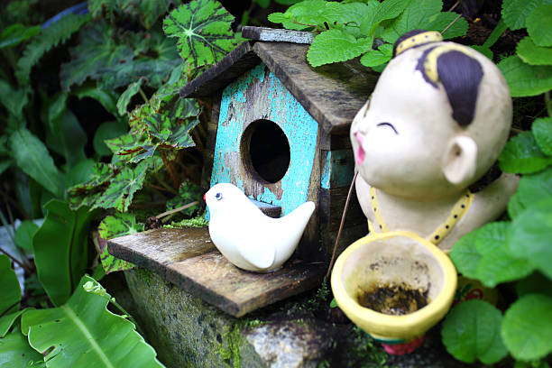 istock Old blue bird house with ceramic  and boy 501711899