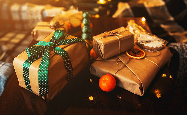 istock Gifts lie on wooden table 501712412