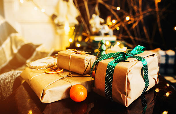 istock Gifts lie on wooden table 501712440