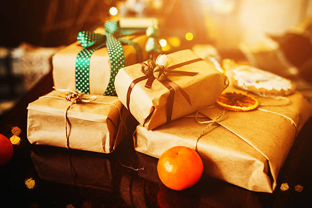 istock Gifts lie on wooden table 501712474