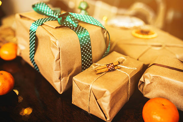 istock Gifts lie on wooden table 501712556