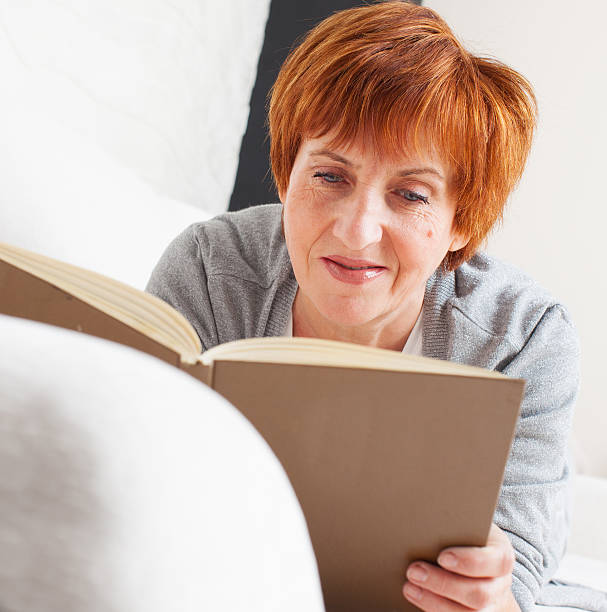 istock Adult woman reading book 501712727