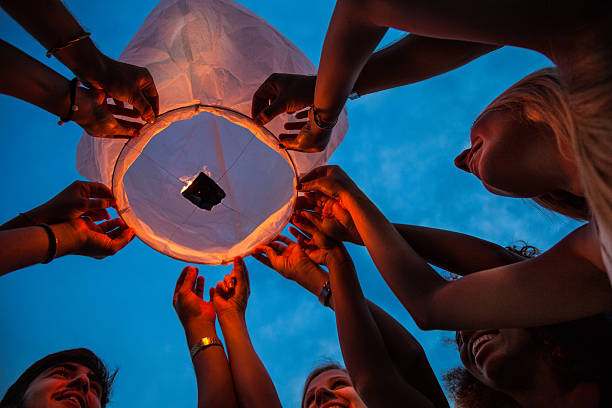 istock Lighting a paper lantern in the air 501715166
