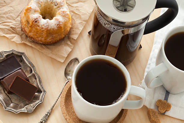 istock Cups of coffee and cake on tray 501716954