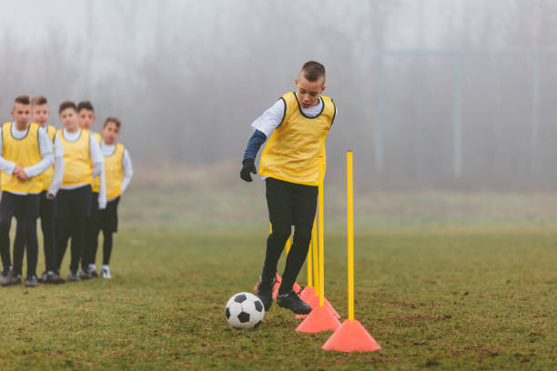 istock Kids Training Soccer Dribbling. 501717950