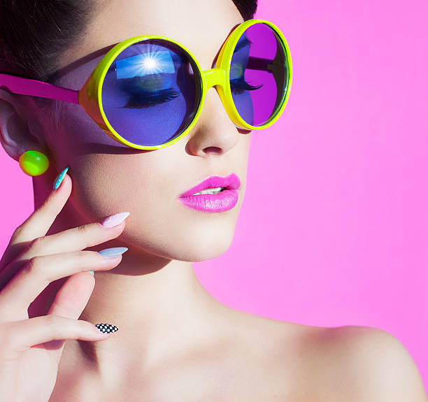 portrait of an attractive young woman with sunglasses stock photo