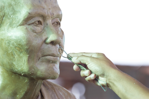 buddha face by wax