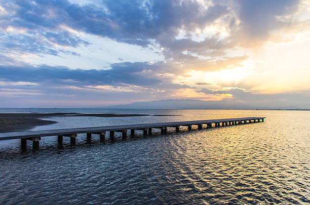 istock pier over sea in delta del ebro at dusk 501732609