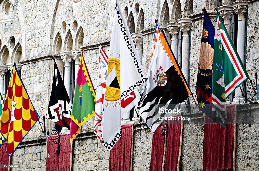Palio of Siena flags Palace  with flags of the different Siena contrades Siena - Italy Stock Photo
