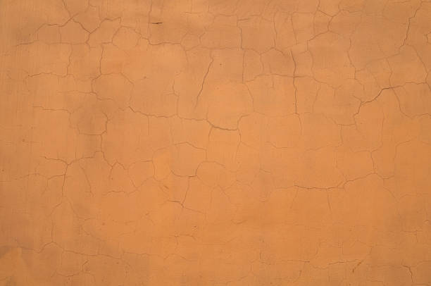istock Texture of cracked yellow wall 501734041