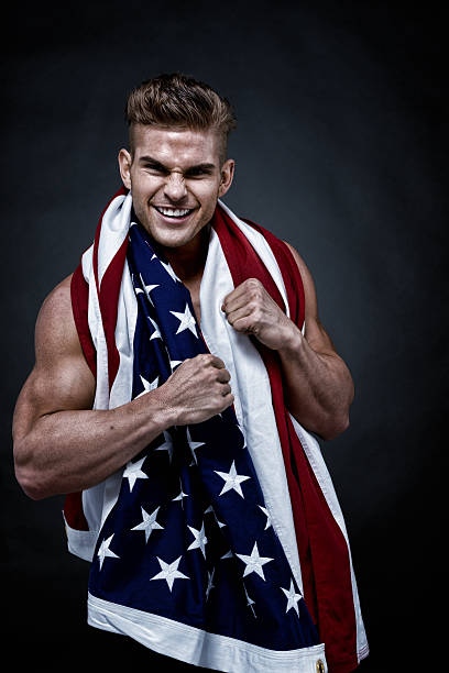 istock Muscular man holding American flag 501734171