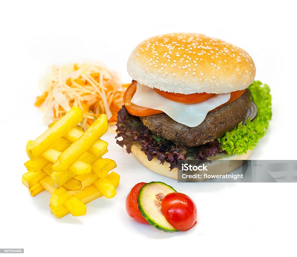 Burger in the restaurant beef with onions, lettuce, French fries & a side salad Backgrounds Stock Photo