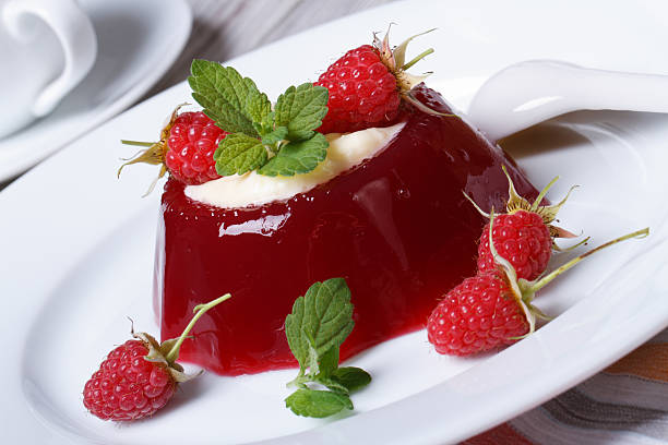 istock Delicate jelly dessert with fresh raspberries  closeup 501734903