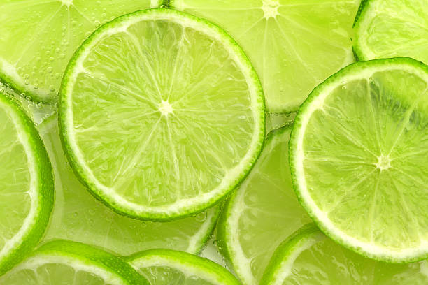 fondo de lima - limones verdes fotografías e imágenes de stock