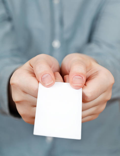 istock blank business card in female hands 501737737