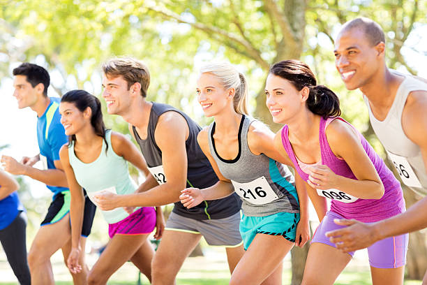 istock Smiling Group Of Marathon Runners At Starting Line In Park 501737865