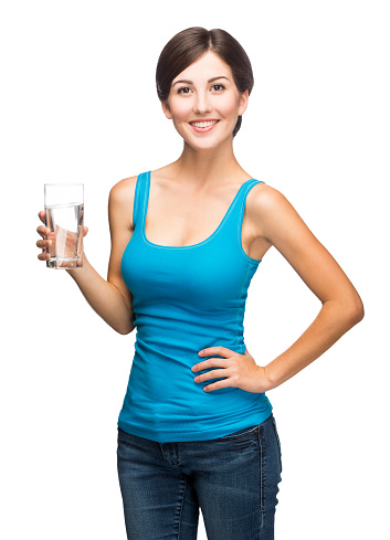A latin woman holding a glass of water.