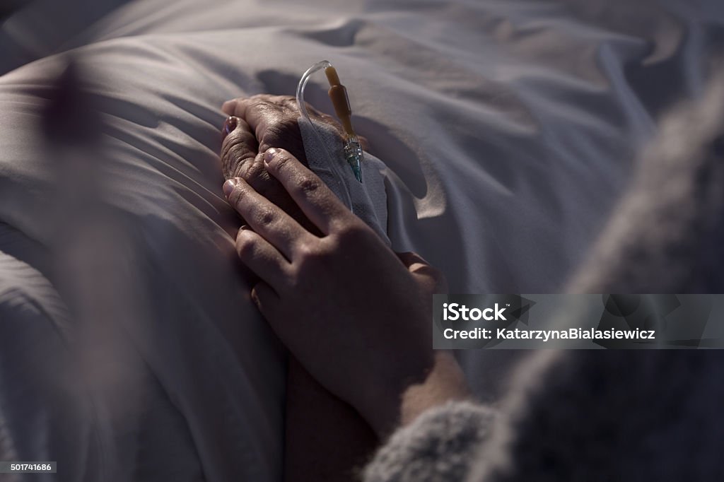 Woman supporting mother with cancer Photo of woman supporting dying mother with cancer Death Stock Photo