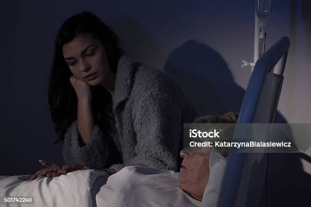 Daughter Worrying About Sick Mother Stock Photo - Download Image Now - 2015, Adult, Bed - Furniture