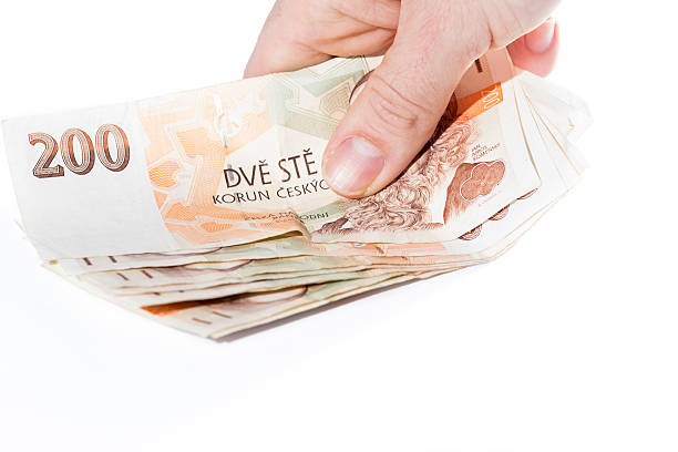 istock Male hand holding czech banknotes 501742380