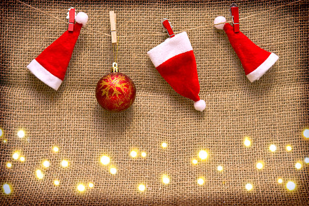 istock Three  Santa hats and red Christmas ball isolated . 501743490