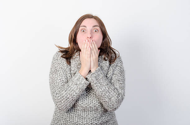 istock Young woman has her hands in her mouth. Surprised 501743594