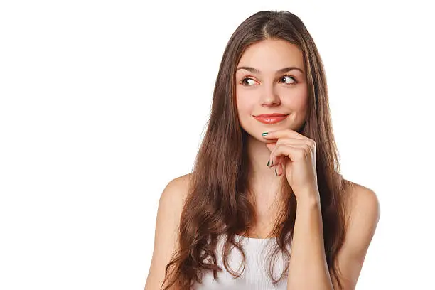 Photo of Young beautiful woman thinking looking to the side, isolated