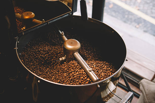 freshly roasted coffee beans n a coffee roaster stock photo