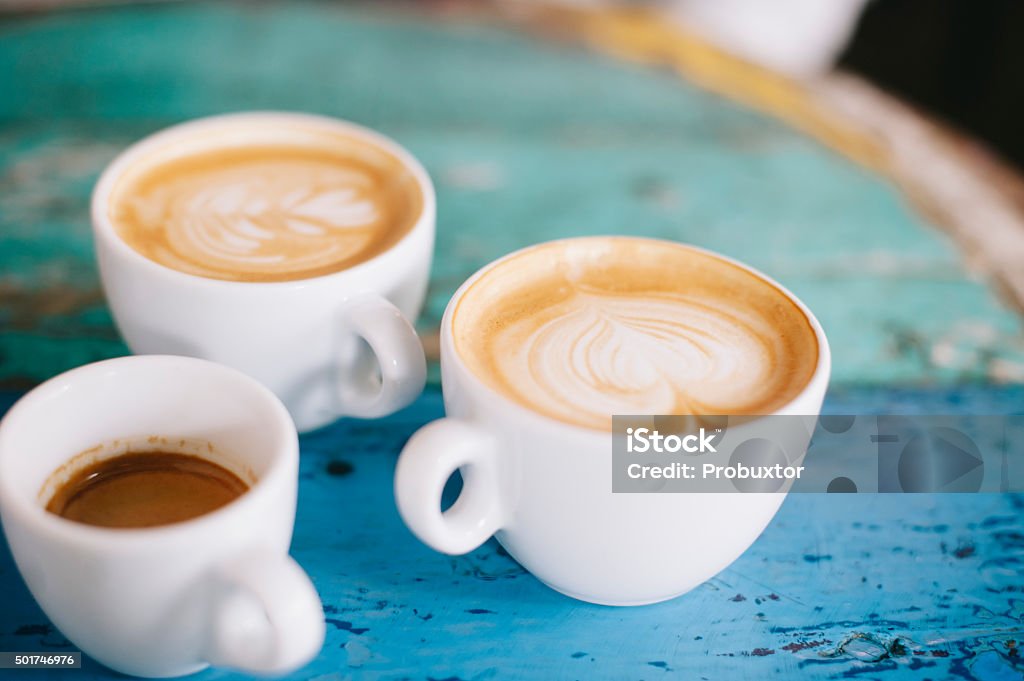 People talking in the cafe while having some fresh coffee Cafe Stock Photo