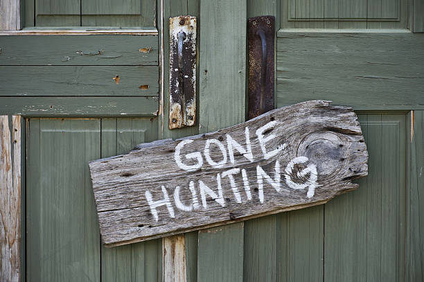 Gone Hunting. Old gone hunting sign. hunting stock pictures, royalty-free photos & images