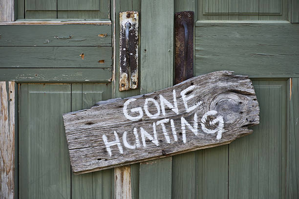 Gone Hunting. Old gone hunting sign. hunter stock pictures, royalty-free photos & images