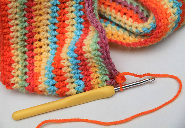 istock Crochet hook and colorful scarf 501748606