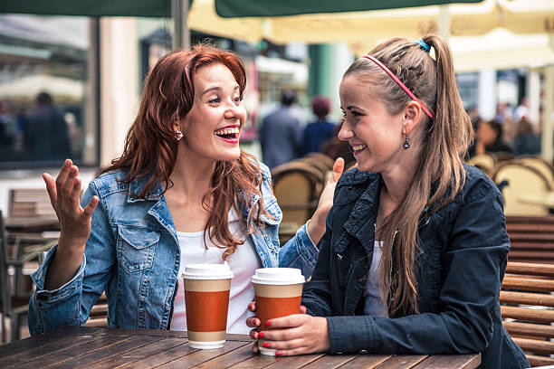 istock Teenagers having fun seated at an outdoor cafeteria 501752012